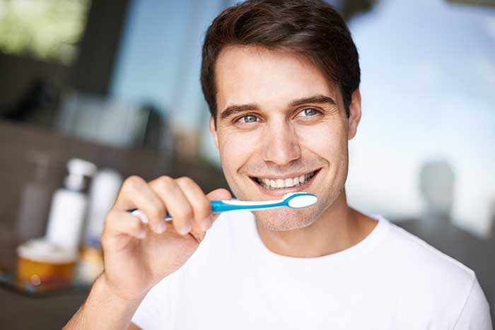 A man brushing his teeth